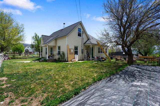 137 West 200 S Street Fairview, UT 84629 - Photo 24 of 34 Light-toned siding exterior with a dark-shingled roof