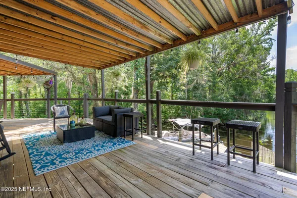 a kitchen with stainless steel appliances granite countertop a sink and a refrigerator