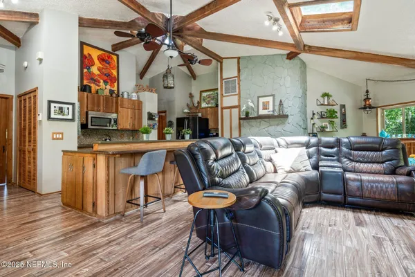 a view of a livingroom with furniture and window