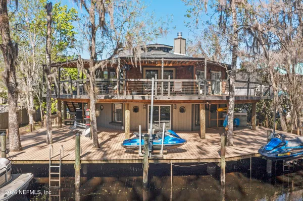 a view of a chairs and table in a patio