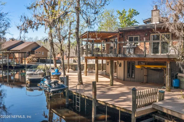 a view of roof deck with chairs and wooden floor