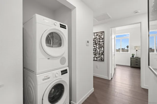 a view of a hallway with washer and dryer