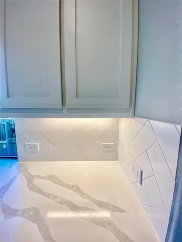 a stove top oven sitting inside of a kitchen