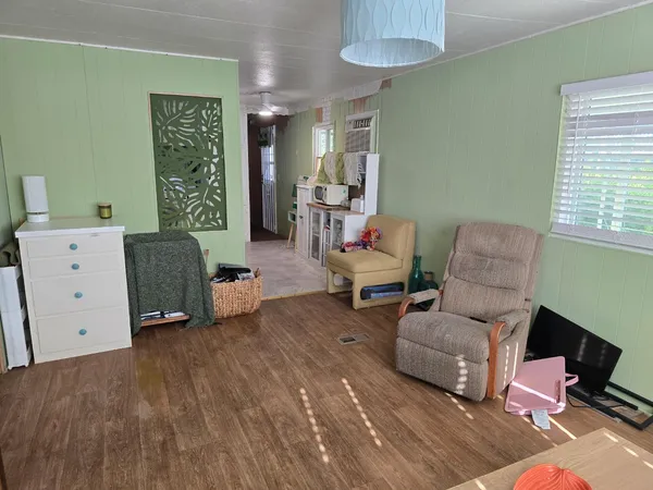 a living room with furniture and a window