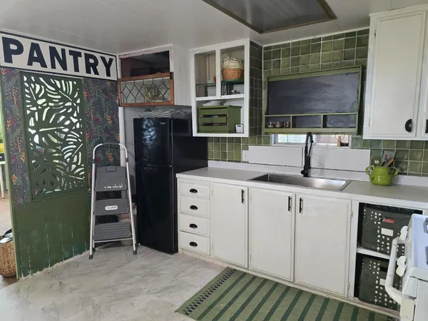 a kitchen with stainless steel appliances a stove and a refrigerator
