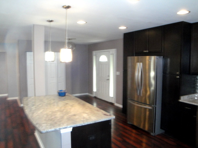 4515 Ashley Drive McHenry, IL 60050 - Photo 17 of 28 a kitchen with stainless steel appliances granite countertop a refrigerator a sink and a refrigerator