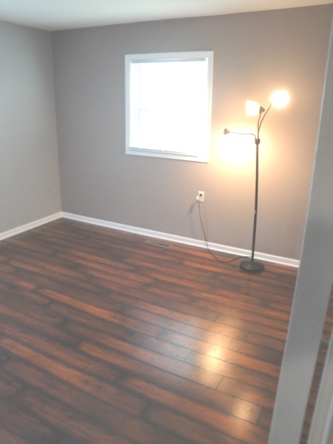 4515 Ashley Drive McHenry, IL 60050 - Photo 19 of 28 a view of a room with wooden floor and a window