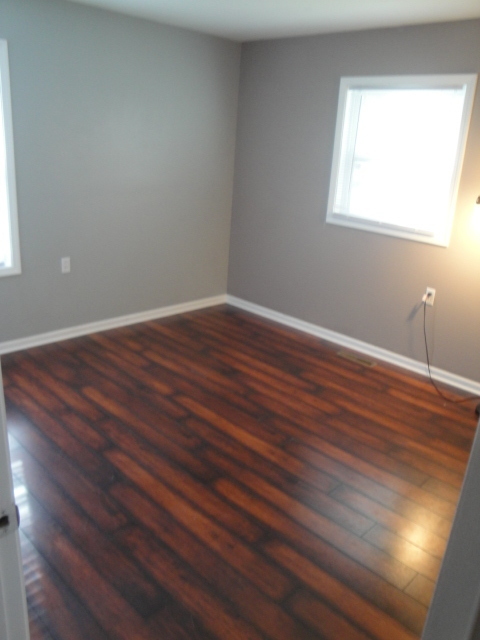 4515 Ashley Drive McHenry, IL 60050 - Photo 20 of 28 a view of an empty room with wooden floor and a window