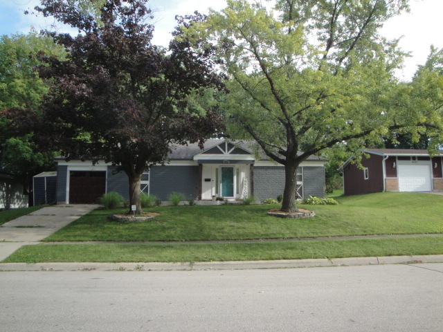 4515 Ashley Drive McHenry, IL 60050 - Photo 2 of 28 a front view of a house with garden