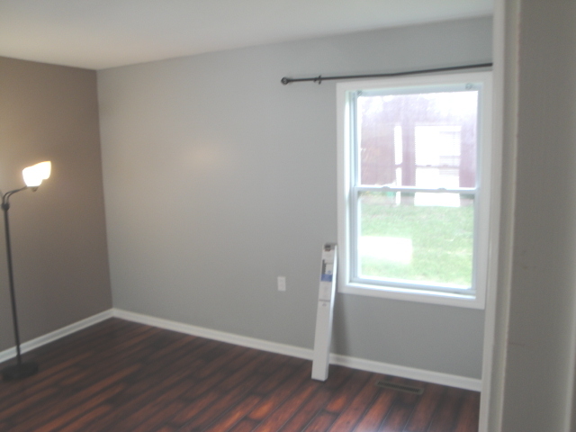 4515 Ashley Drive McHenry, IL 60050 - Photo 24 of 28 a view of an empty room with wooden floor and a window