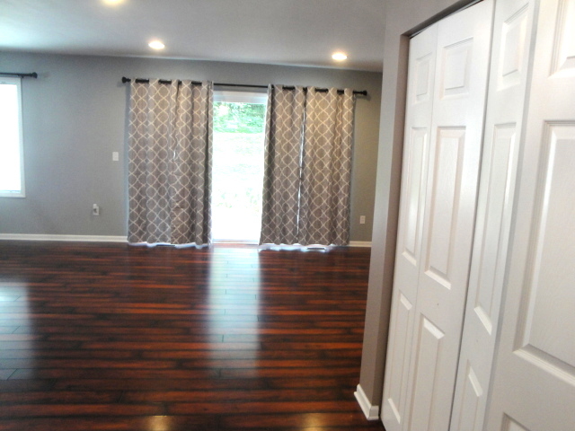 4515 Ashley Drive McHenry, IL 60050 - Photo 6 of 28 a view of room with window and wooden floor