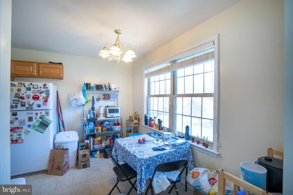 a view of a dining room with furniture and a window
