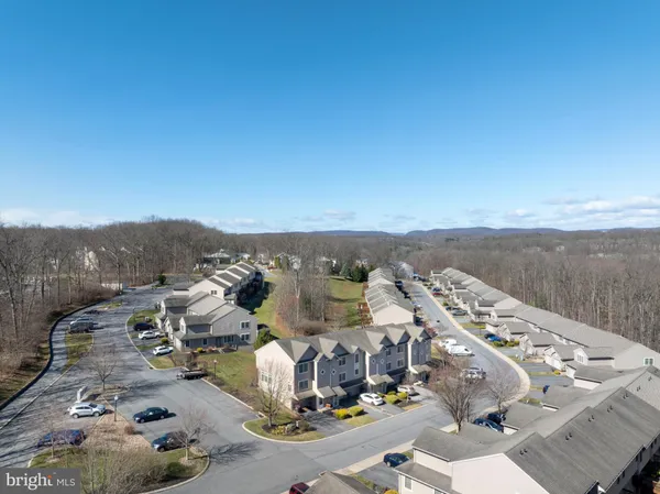 an aerial view of a house with a garden