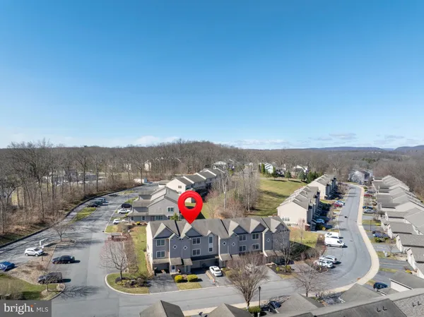 a front view of a house with sitting area