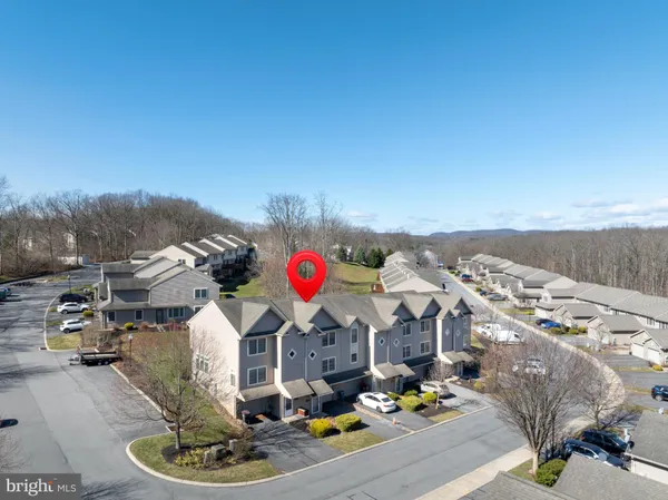 an aerial view of a house with a garden