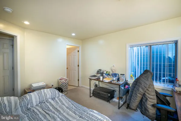 a bedroom with furniture and a wooden floor
