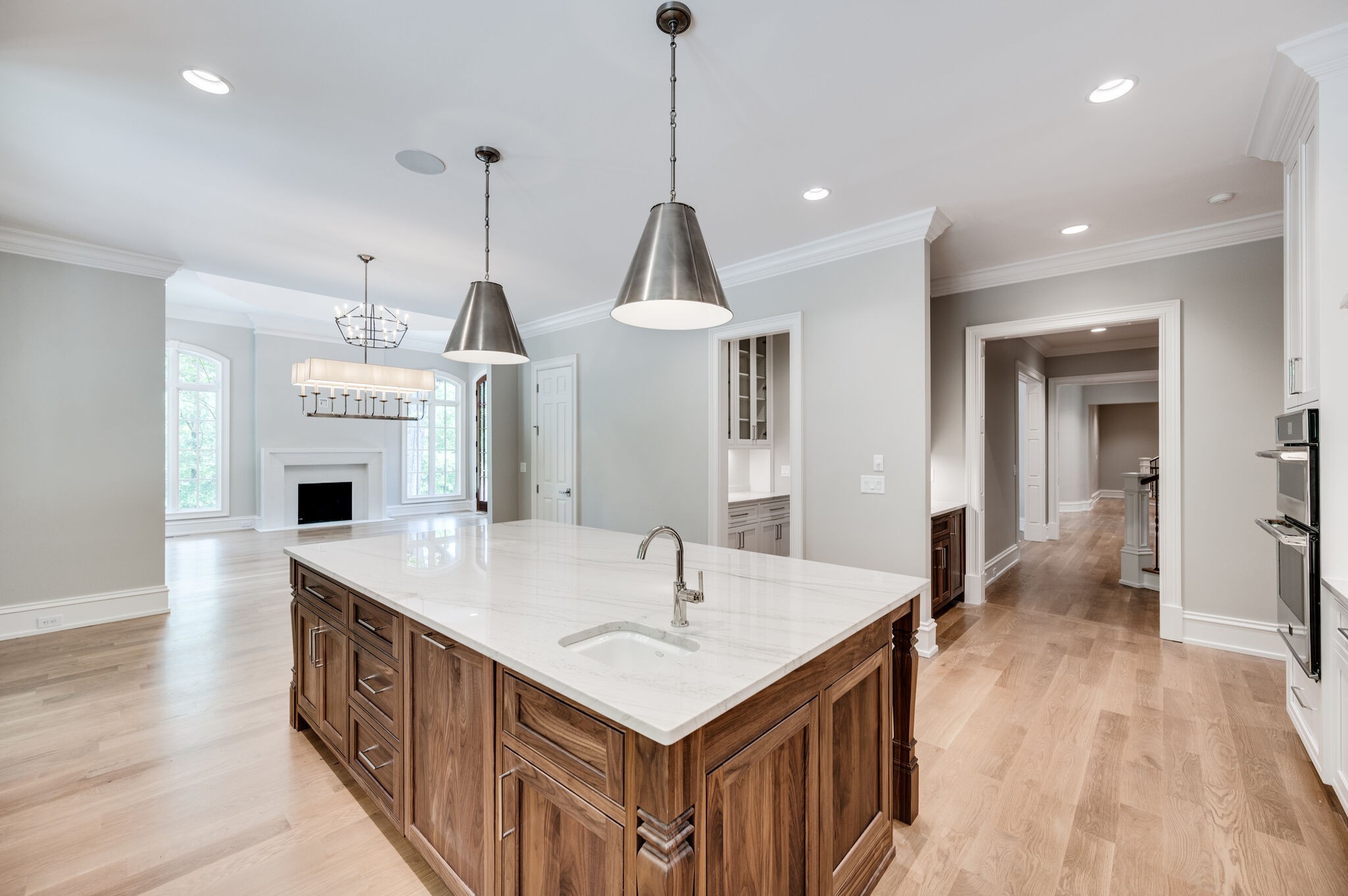 1073 Vaughn Crest Boulevard Franklin, TN 37069 - Photo 12 of 70 a kitchen with kitchen island a sink a center island and stainless steel appliances