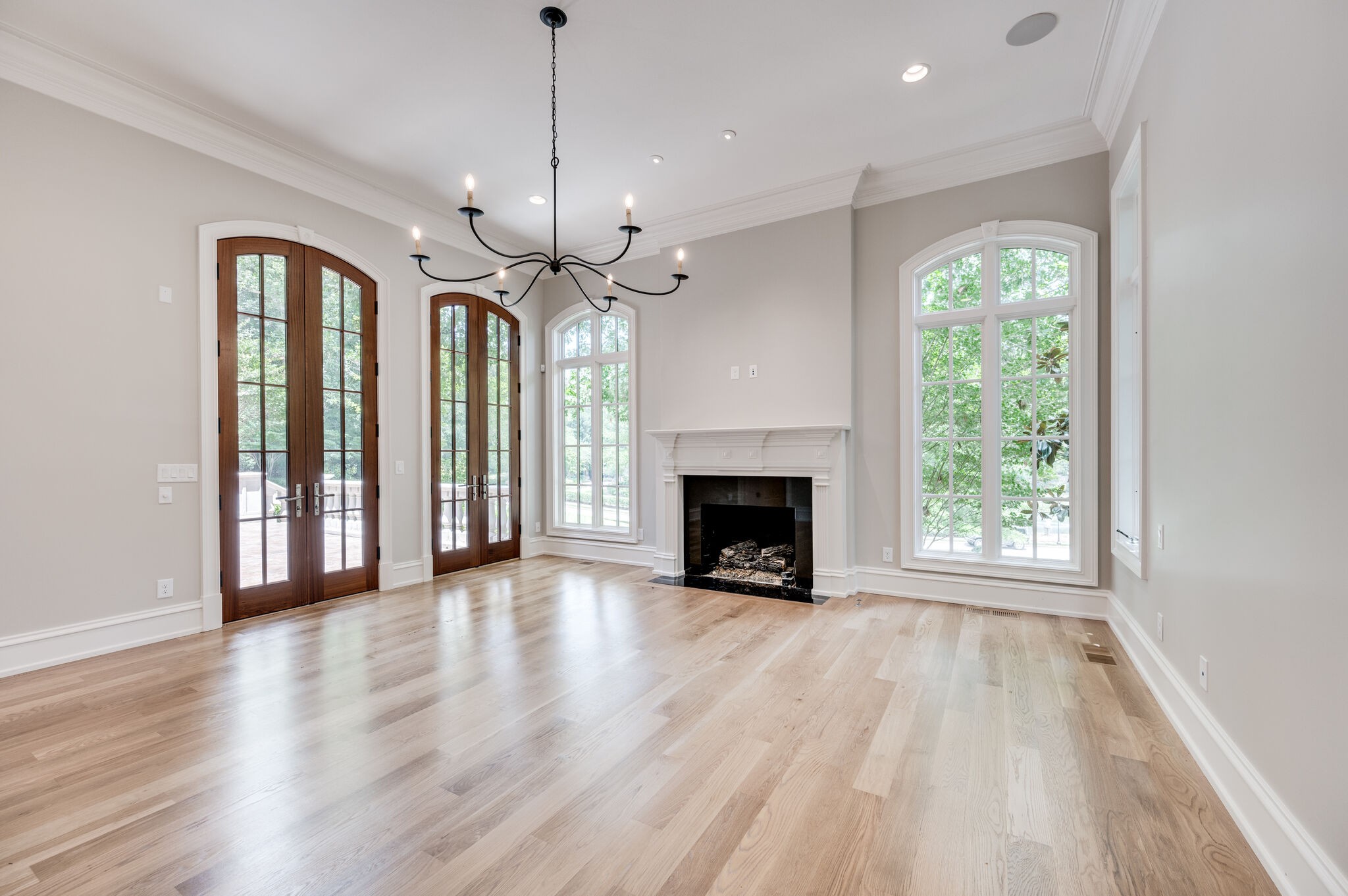 1073 Vaughn Crest Boulevard Franklin, TN 37069 - Photo 20 of 70 a view of an empty room with wooden floor fireplace and a window