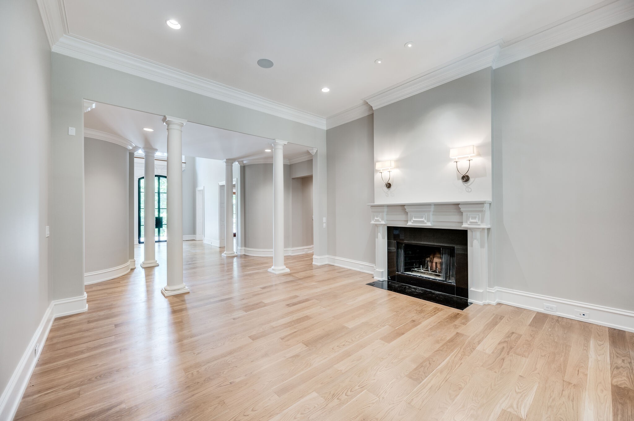 1073 Vaughn Crest Boulevard Franklin, TN 37069 - Photo 28 of 70 a view of empty room with wooden floor and fireplace