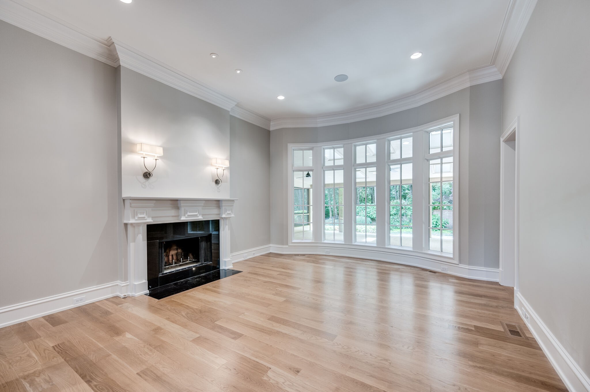 1073 Vaughn Crest Boulevard Franklin, TN 37069 - Photo 29 of 70 a view of empty room with wooden floor and fireplace