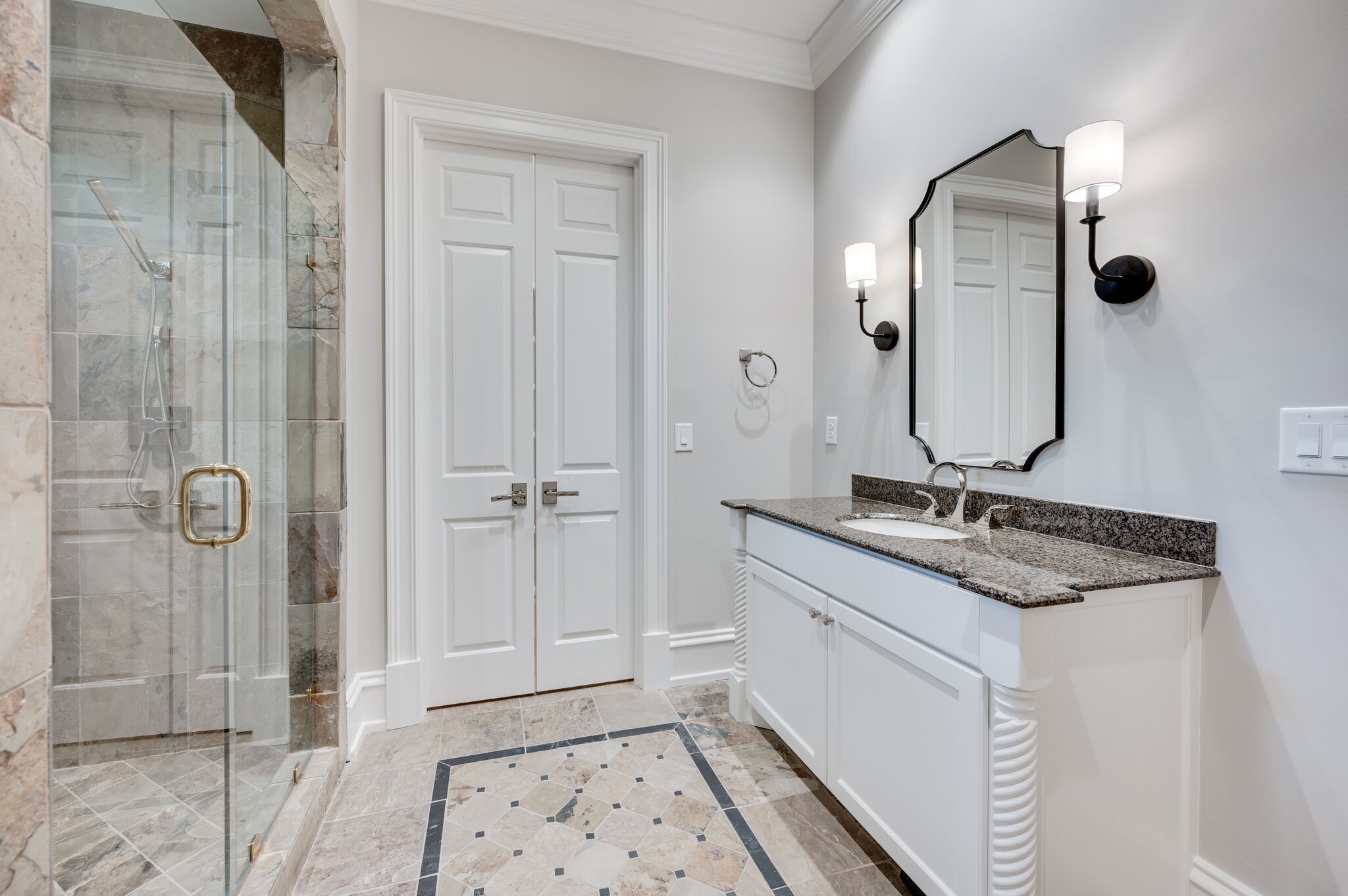 1073 Vaughn Crest Boulevard Franklin, TN 37069 - Photo 31 of 70 a bathroom with a granite countertop sink a mirror and shower