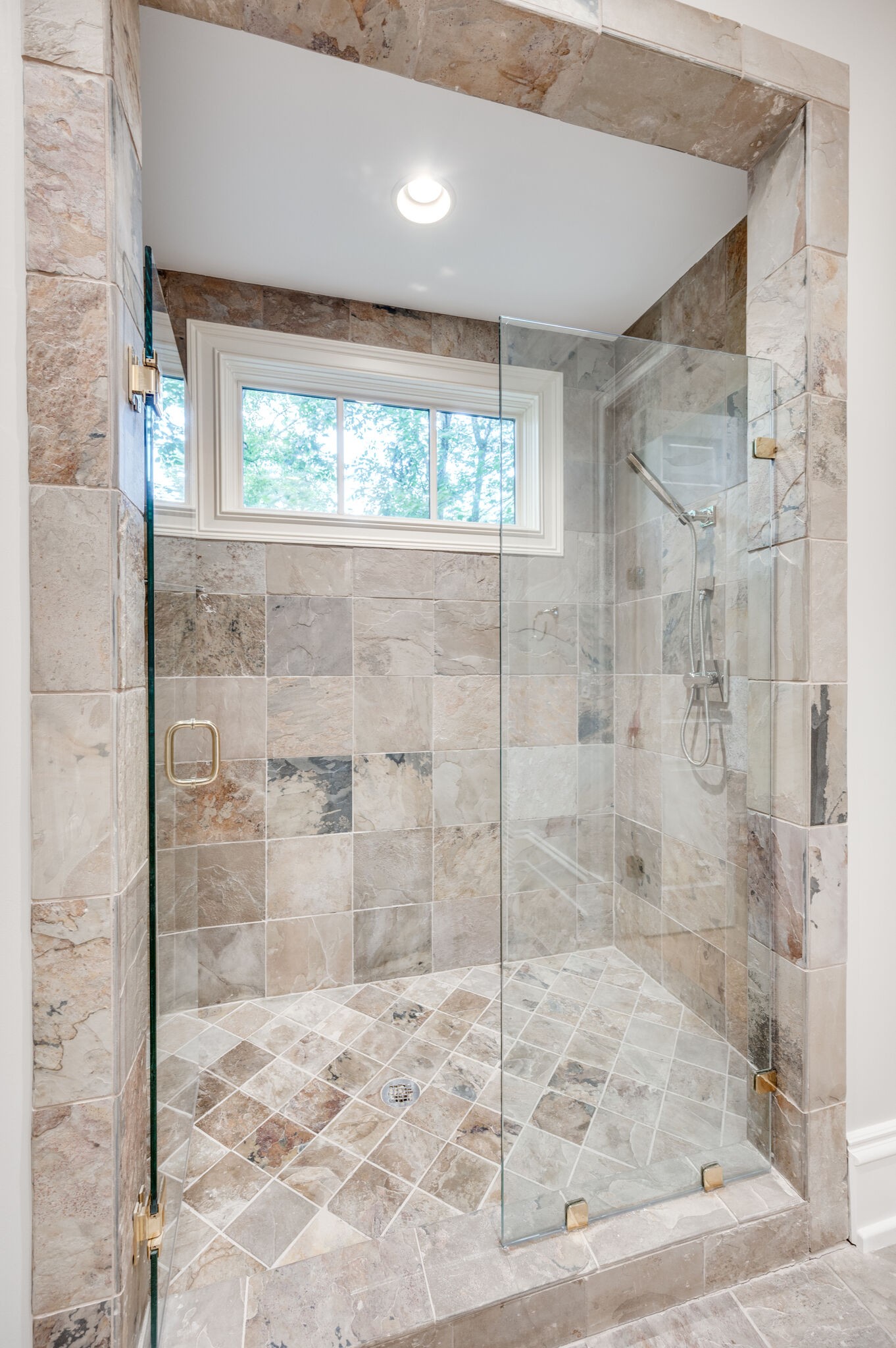 1073 Vaughn Crest Boulevard Franklin, TN 37069 - Photo 33 of 70 a bathroom with a glass shower door