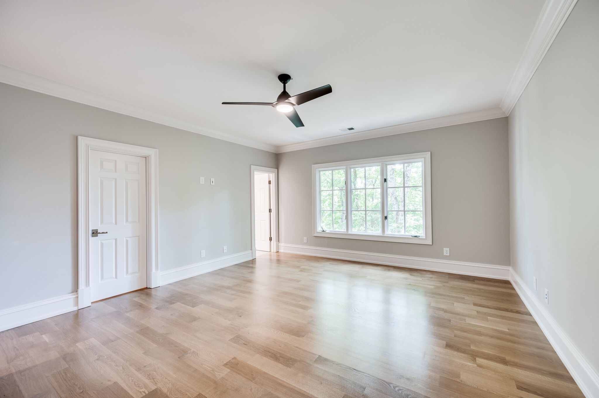1073 Vaughn Crest Boulevard Franklin, TN 37069 - Photo 35 of 70 a view of empty room with wooden floor and fan