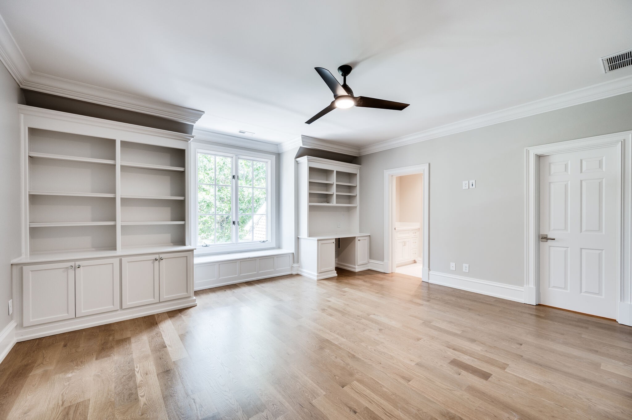 1073 Vaughn Crest Boulevard Franklin, TN 37069 - Photo 37 of 70 a view of an empty room with a window and wooden floor