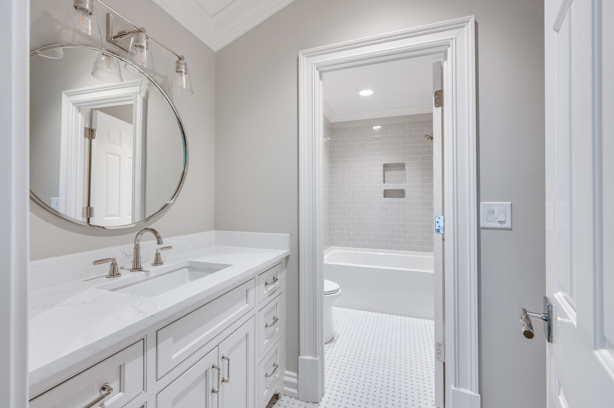 1073 Vaughn Crest Boulevard Franklin, TN 37069 - Photo 38 of 70 a bathroom with a sink a vanity a mirror and a mirror