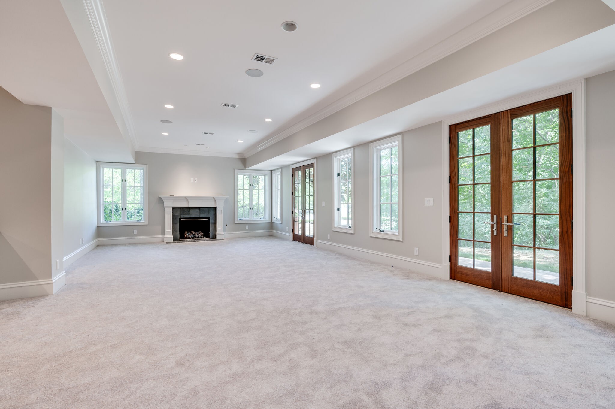 1073 Vaughn Crest Boulevard Franklin, TN 37069 - Photo 46 of 70 a view of an empty room with a fireplace and a window