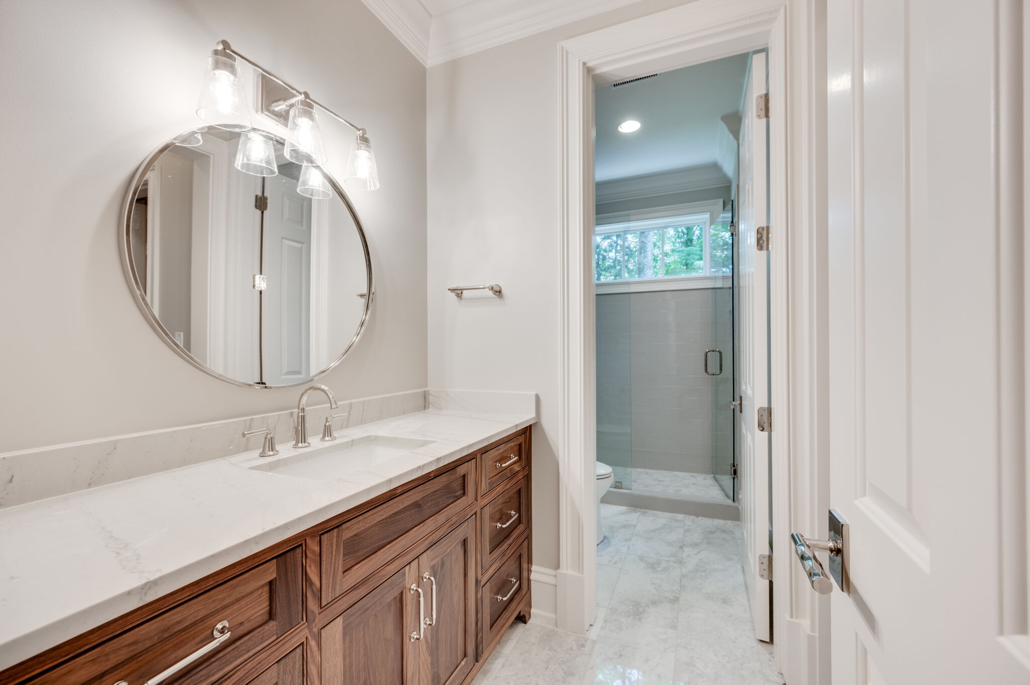 1073 Vaughn Crest Boulevard Franklin, TN 37069 - Photo 53 of 70 a bathroom with a sink vanity and a mirror