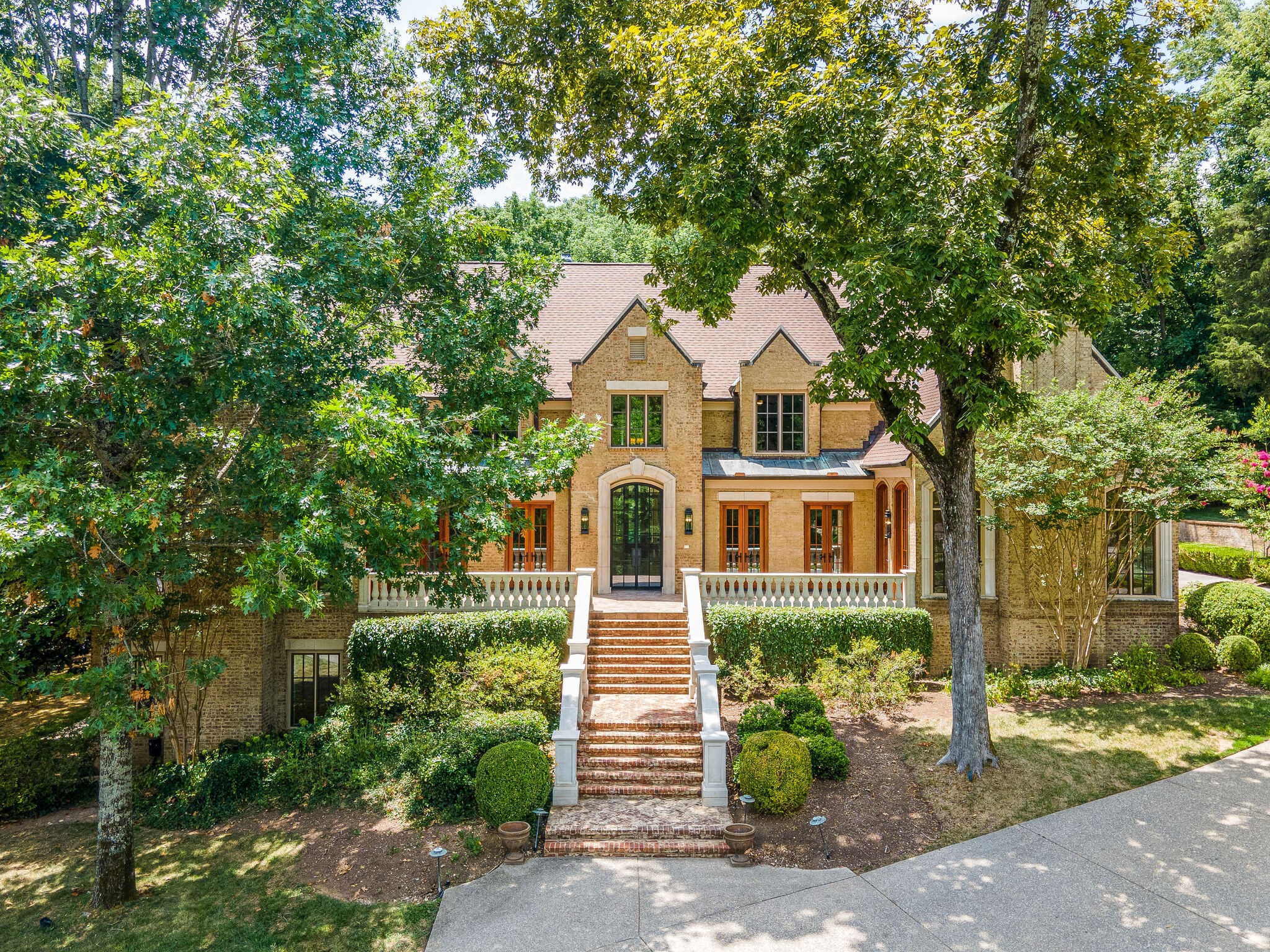 1073 Vaughn Crest Boulevard Franklin, TN 37069 - Photo 67 of 70 a front view of a house with a garden