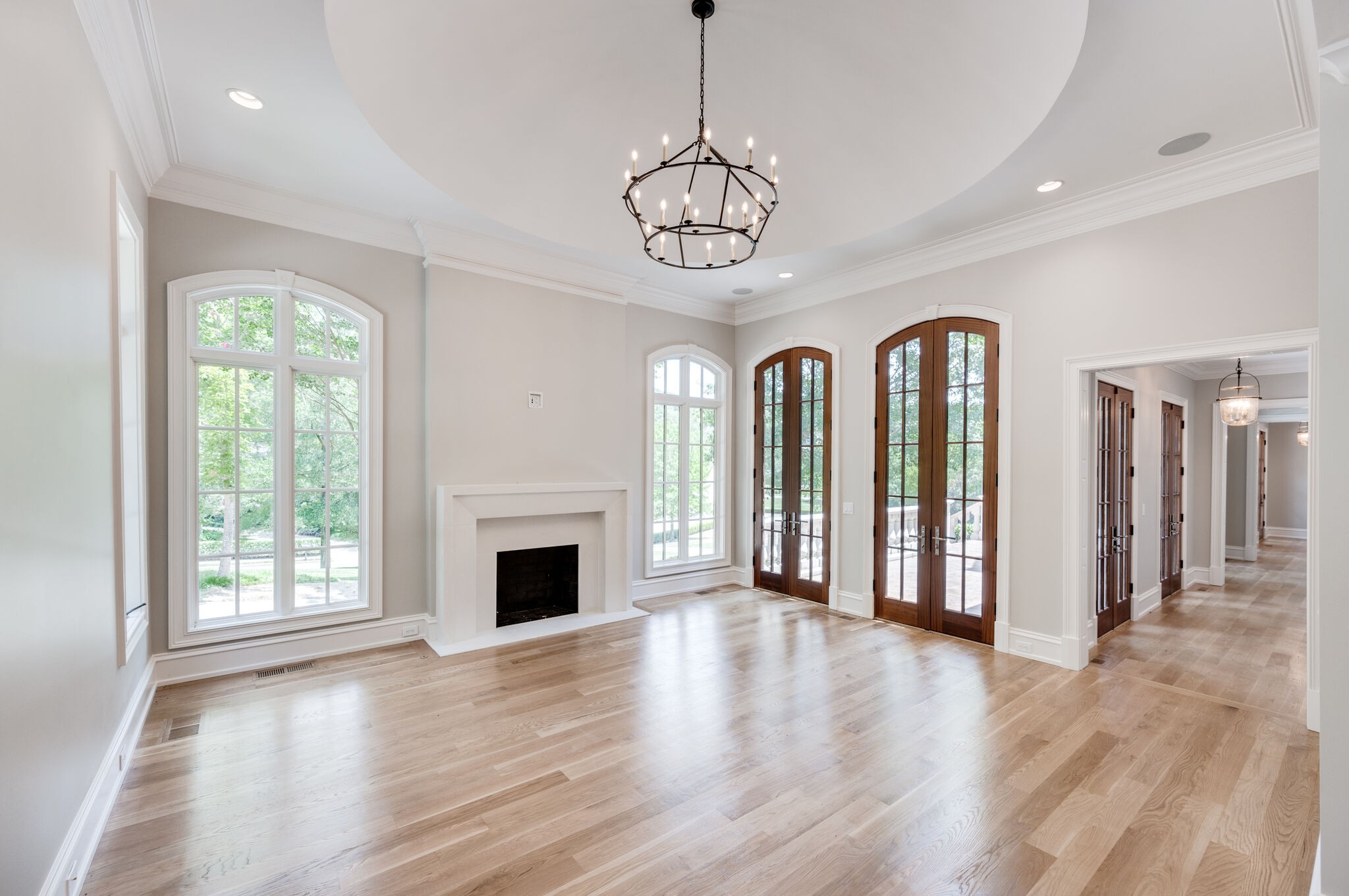 1073 Vaughn Crest Boulevard Franklin, TN 37069 - Photo 7 of 70 an empty room with wooden floor fan and windows