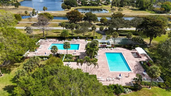 an aerial view of a house with a lake view