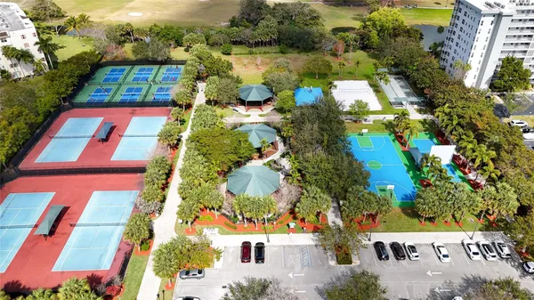 an aerial view of a houses with yard