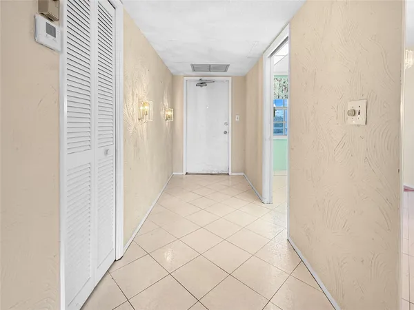 a view of a room with white walls