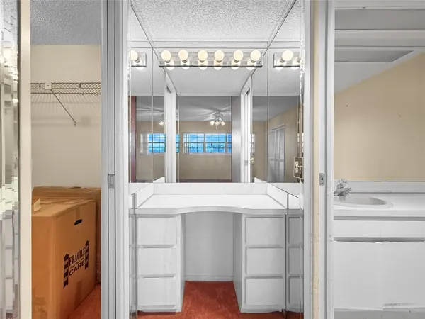 a room with a sink and a mirror