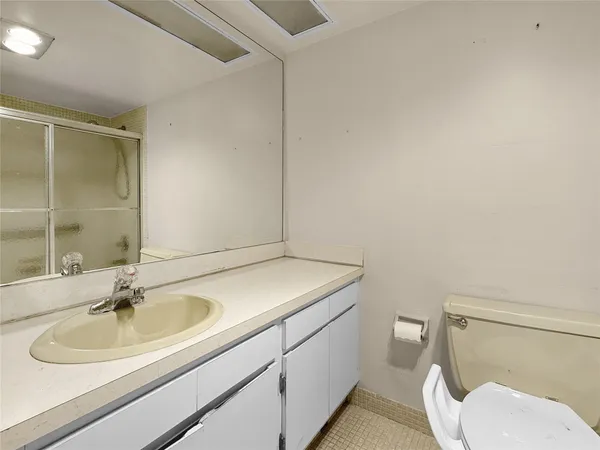 a bathroom with a sink toilet and vanity