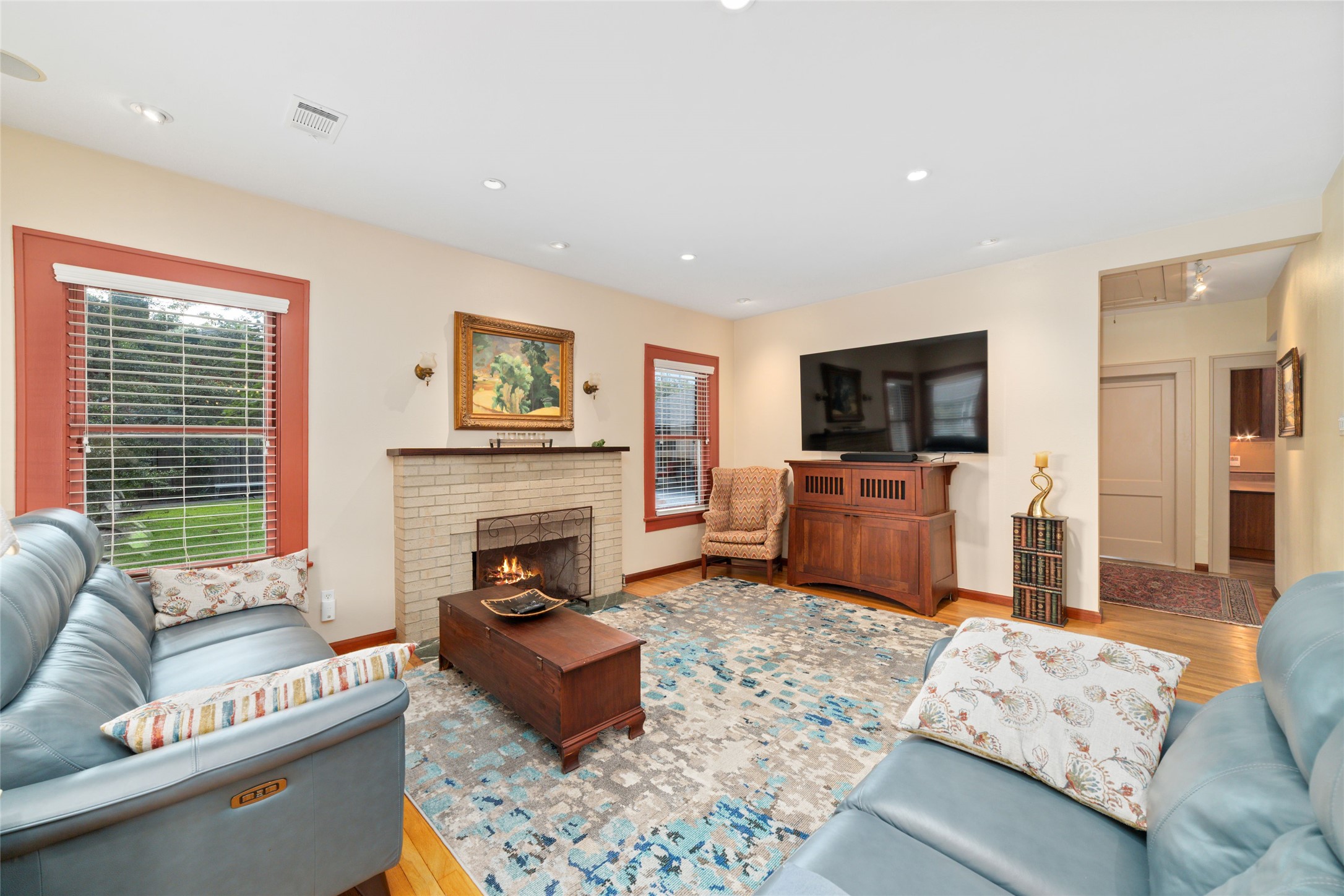 1613 California Street Houston, TX 77006 - Photo 12 of 50 More than a beautiful gathering space, this room has quietly witnessed decades of everyday life, holiday celebrations, and life's most meaningful moments. Anchored by its timeless fireplace, it's the kind of room that naturally becomes the heart of a home.