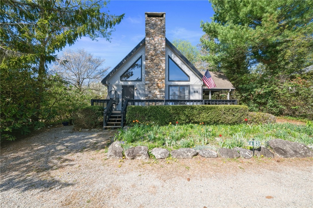 83 Pine Ridge Loop Newland, NC 28657 - Photo 27 of 32 a front view of a house with a yard