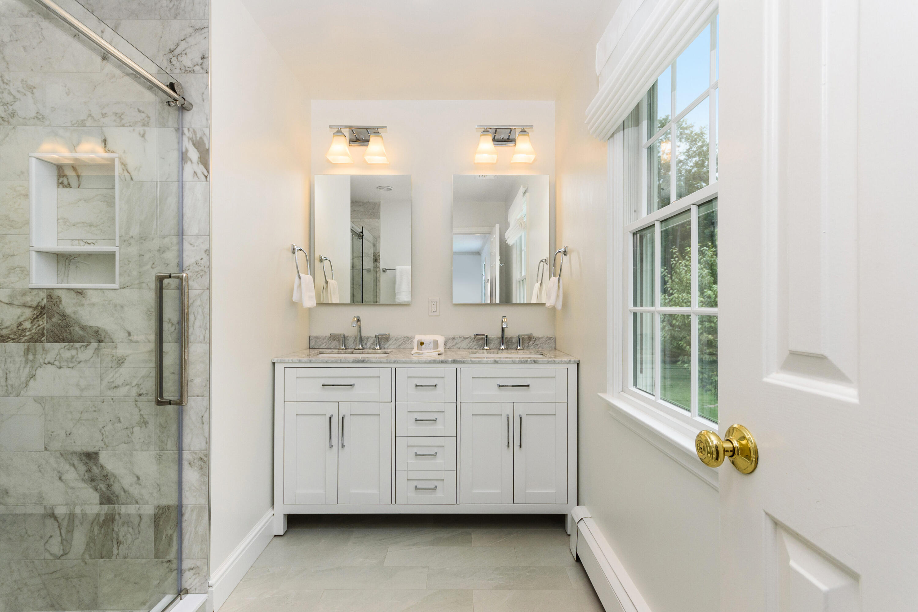 2 Hedge Row Darien, CT 06820 - Photo 20 of 38 a bathroom with a sink mirror and a bathtub