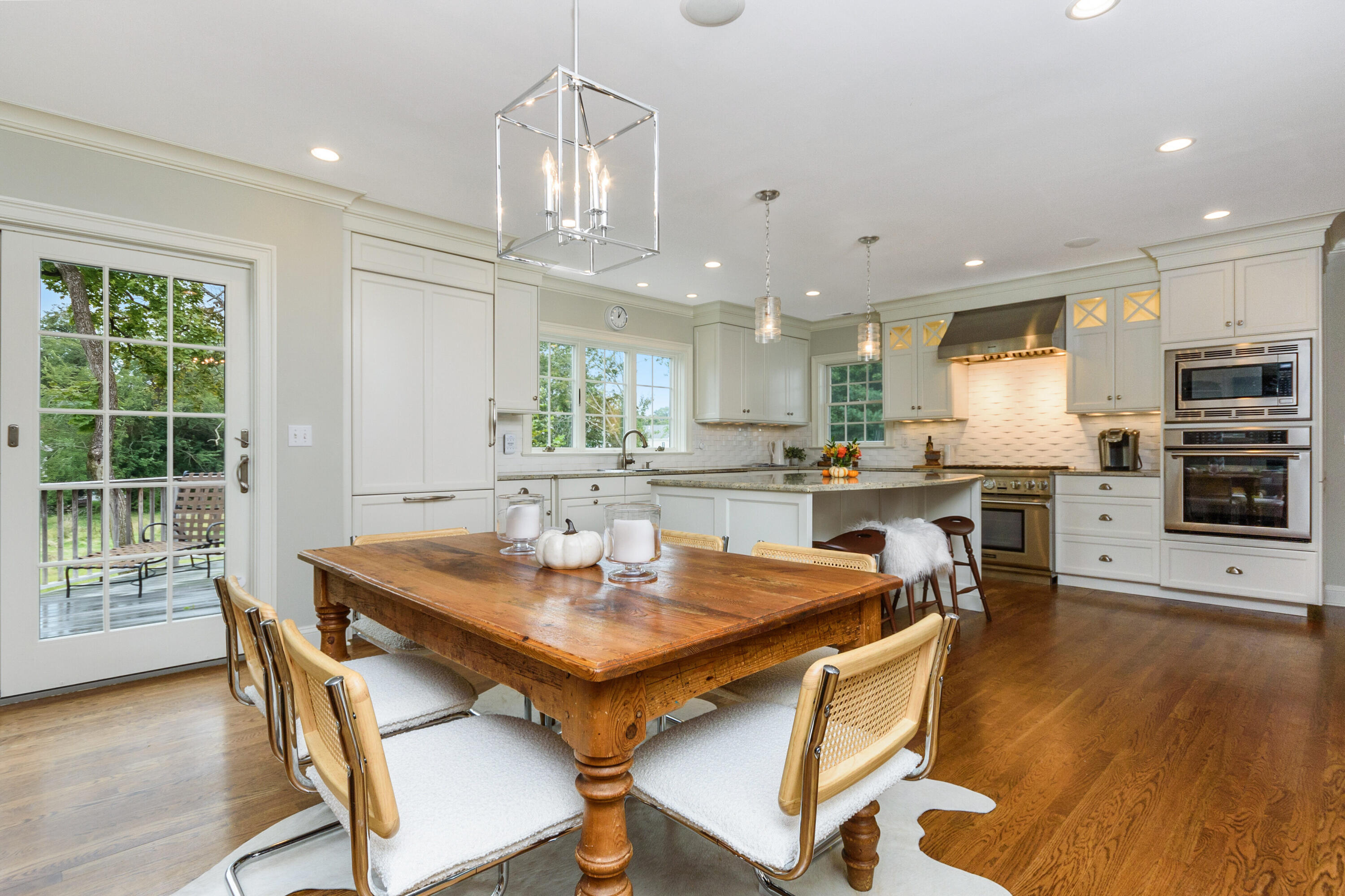 2 Hedge Row Darien, CT 06820 - Photo 2 of 38 a kitchen with a dining table chairs and stove