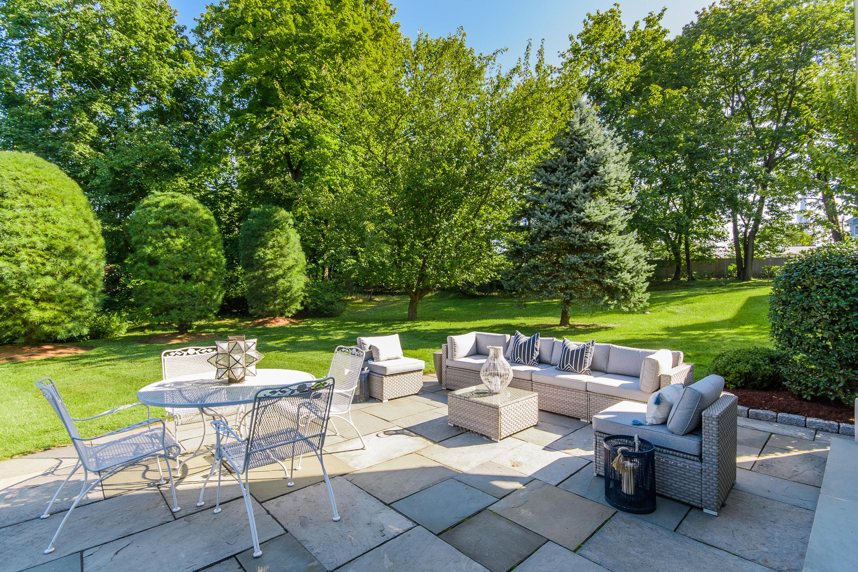 2 Hedge Row Darien, CT 06820 - Photo 29 of 38 a view of a patio with a chairs and table in a yard