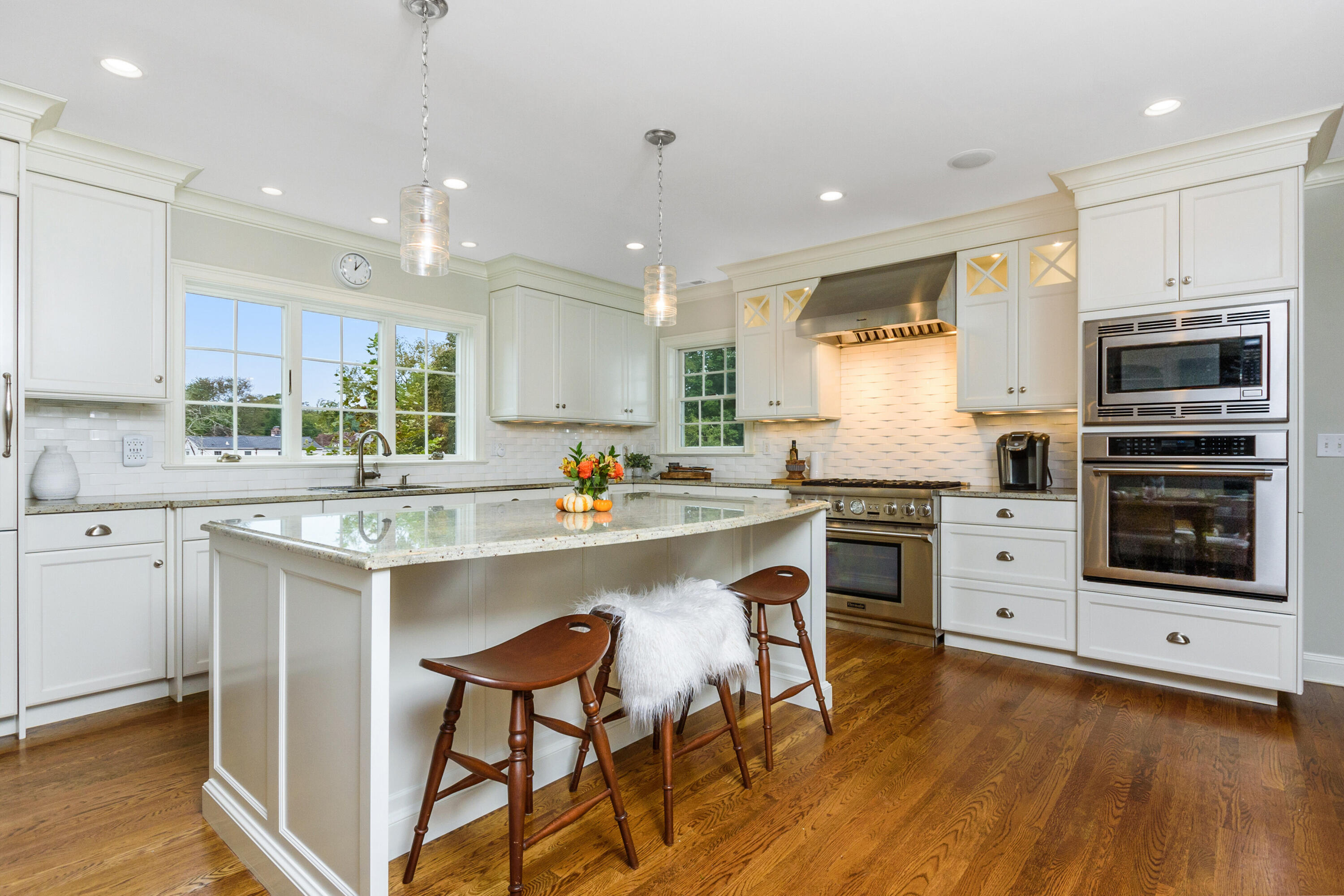 2 Hedge Row Darien, CT 06820 - Photo 3 of 38 a kitchen with stainless steel appliances granite countertop a stove top oven a sink dishwasher and a refrigerator with wooden floor