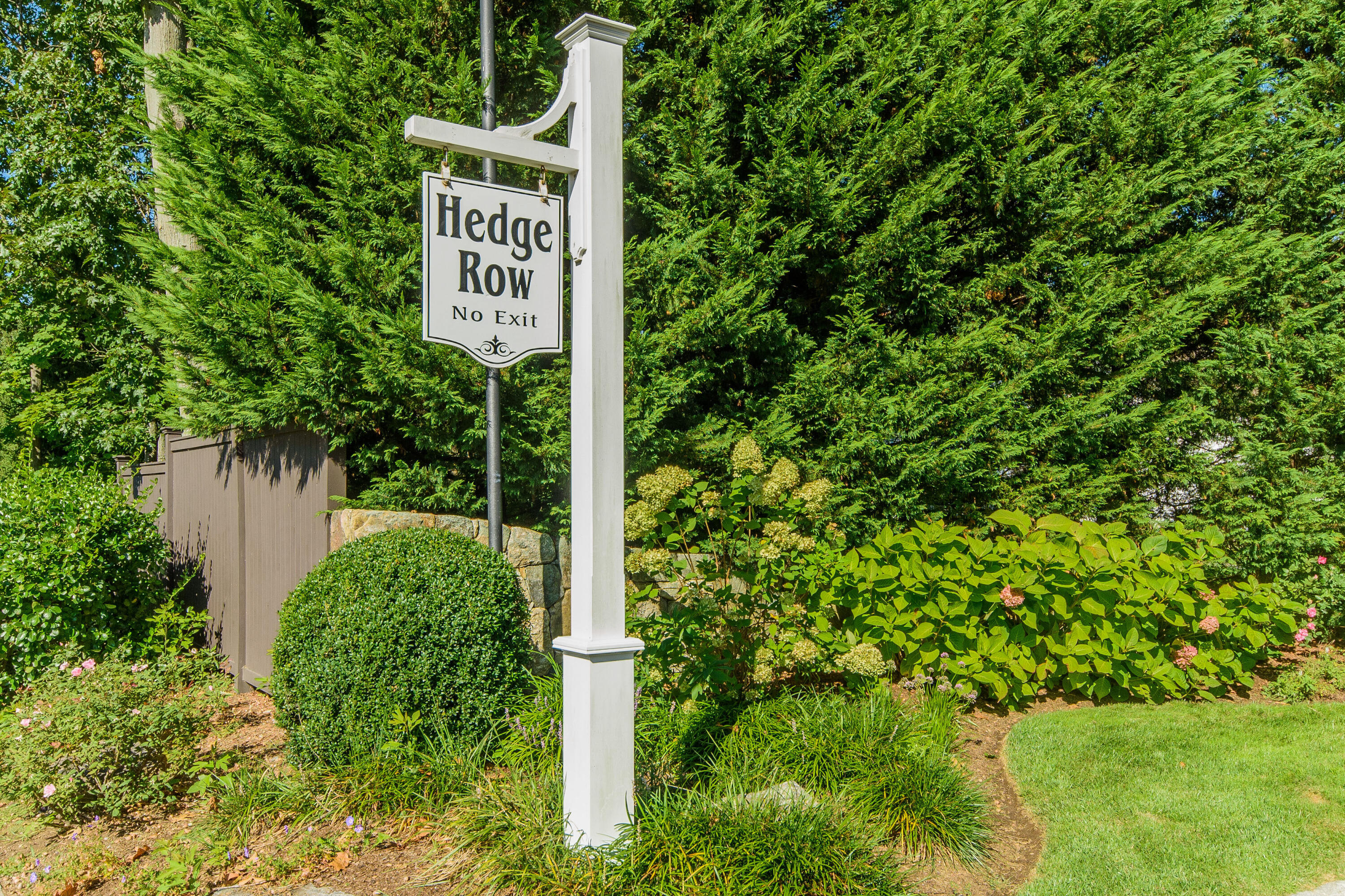 2 Hedge Row Darien, CT 06820 - Photo 35 of 38 a sign that is sitting in front of a tree