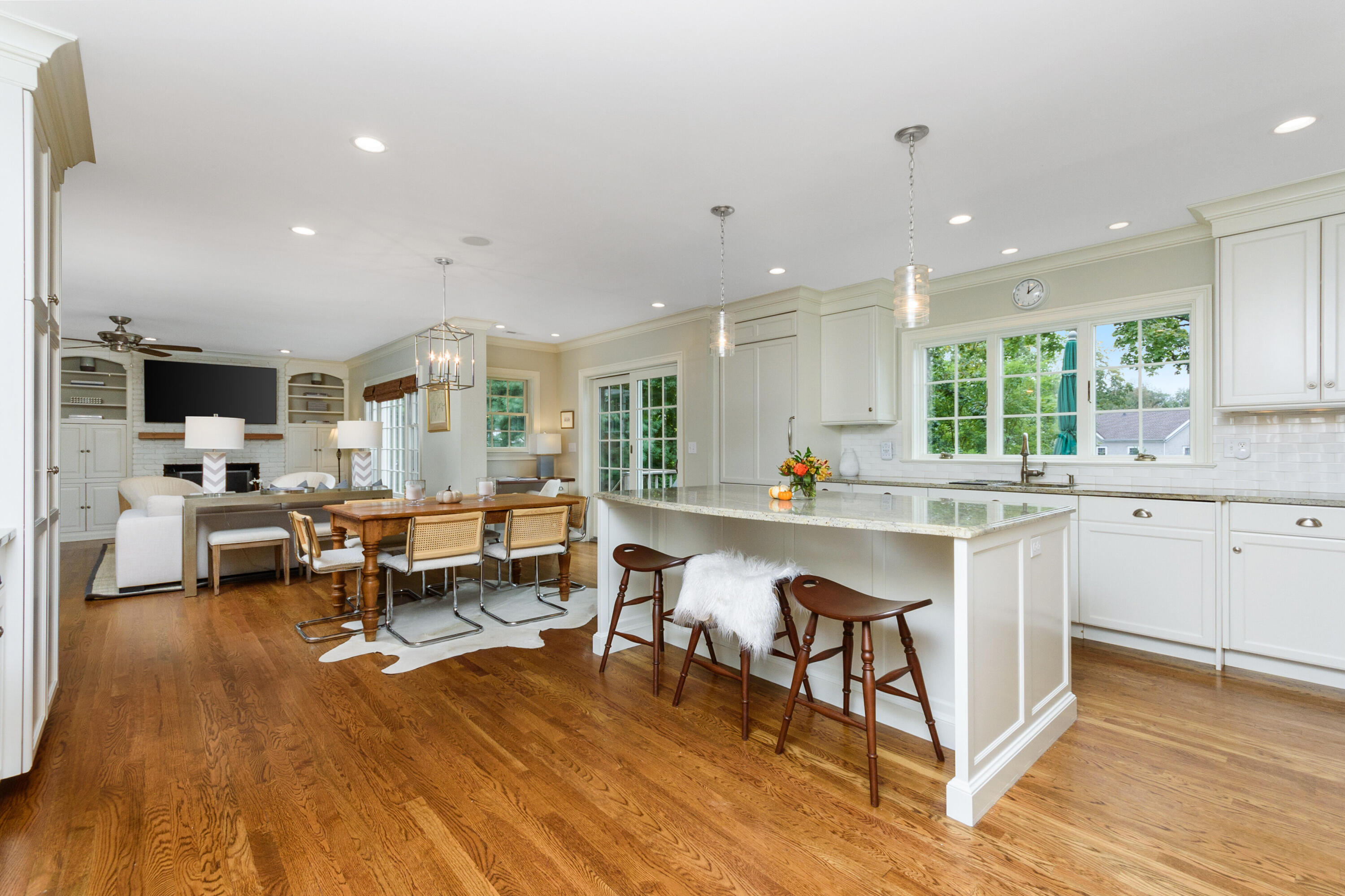 2 Hedge Row Darien, CT 06820 - Photo 4 of 38 a living room with stainless steel appliances granite countertop furniture wooden floor and a view of kitchen