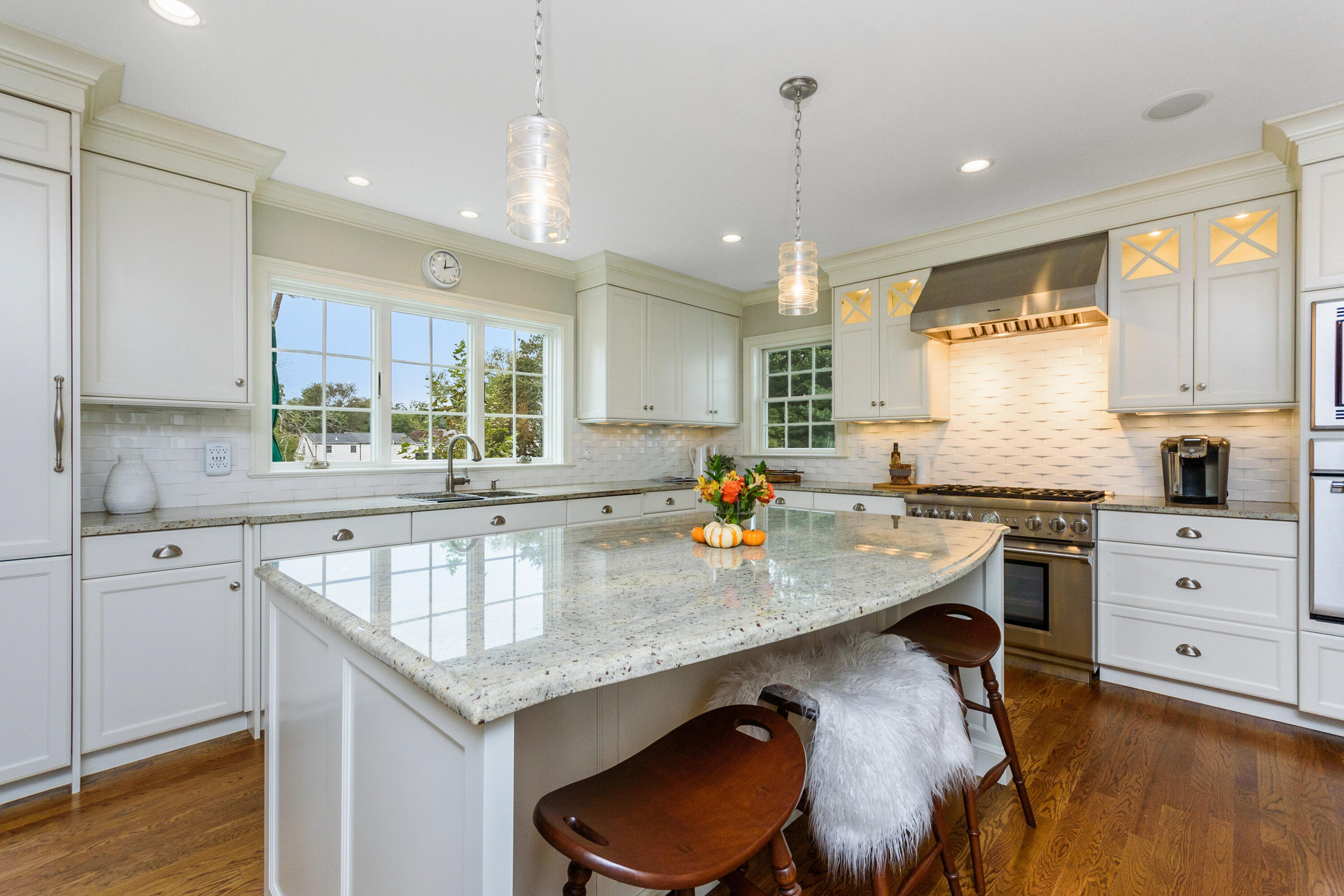 2 Hedge Row Darien, CT 06820 - Photo 5 of 38 a kitchen with stainless steel appliances granite countertop a sink a stove counter space and a window