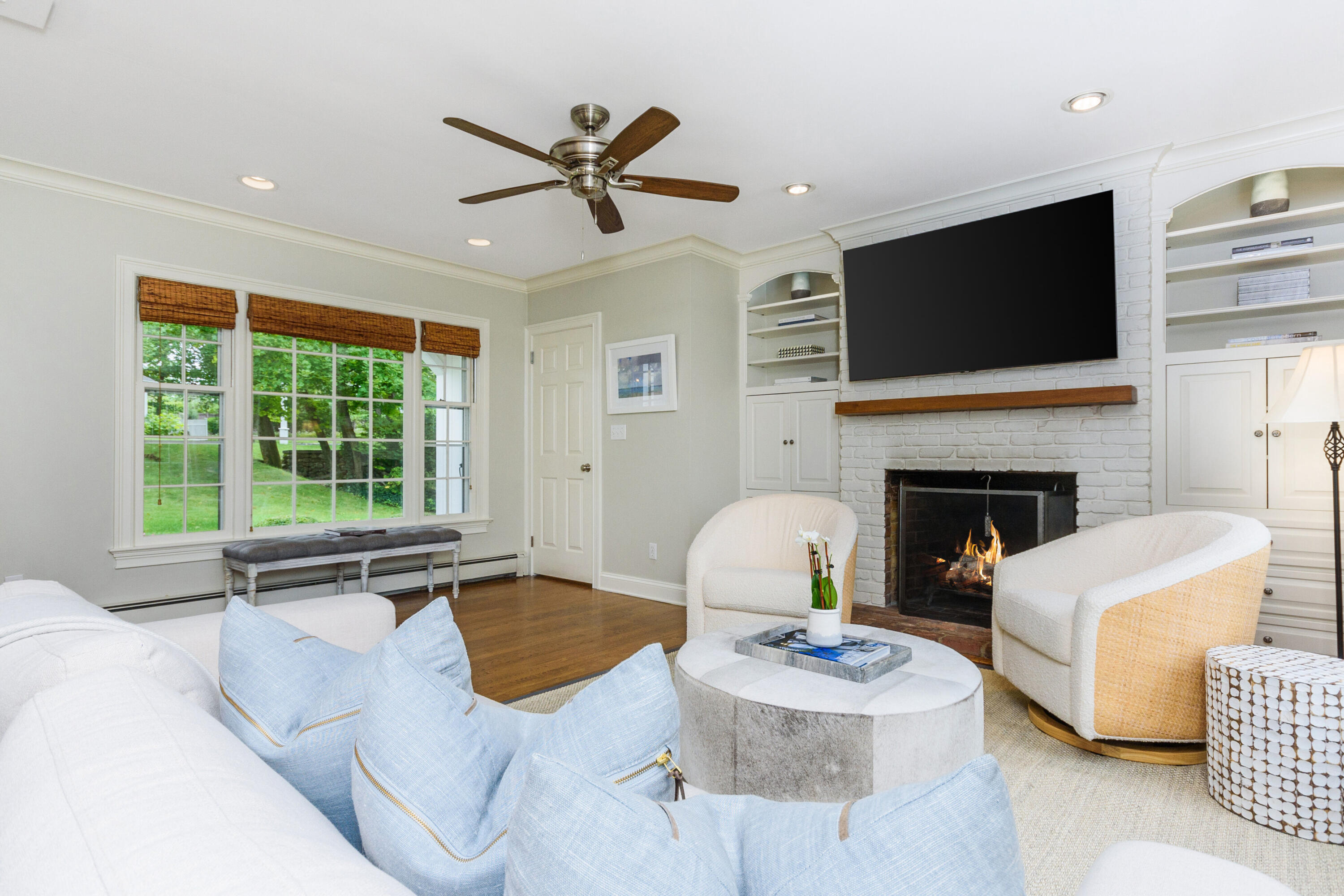 2 Hedge Row Darien, CT 06820 - Photo 8 of 38 a living room with furniture fireplace and flat screen tv