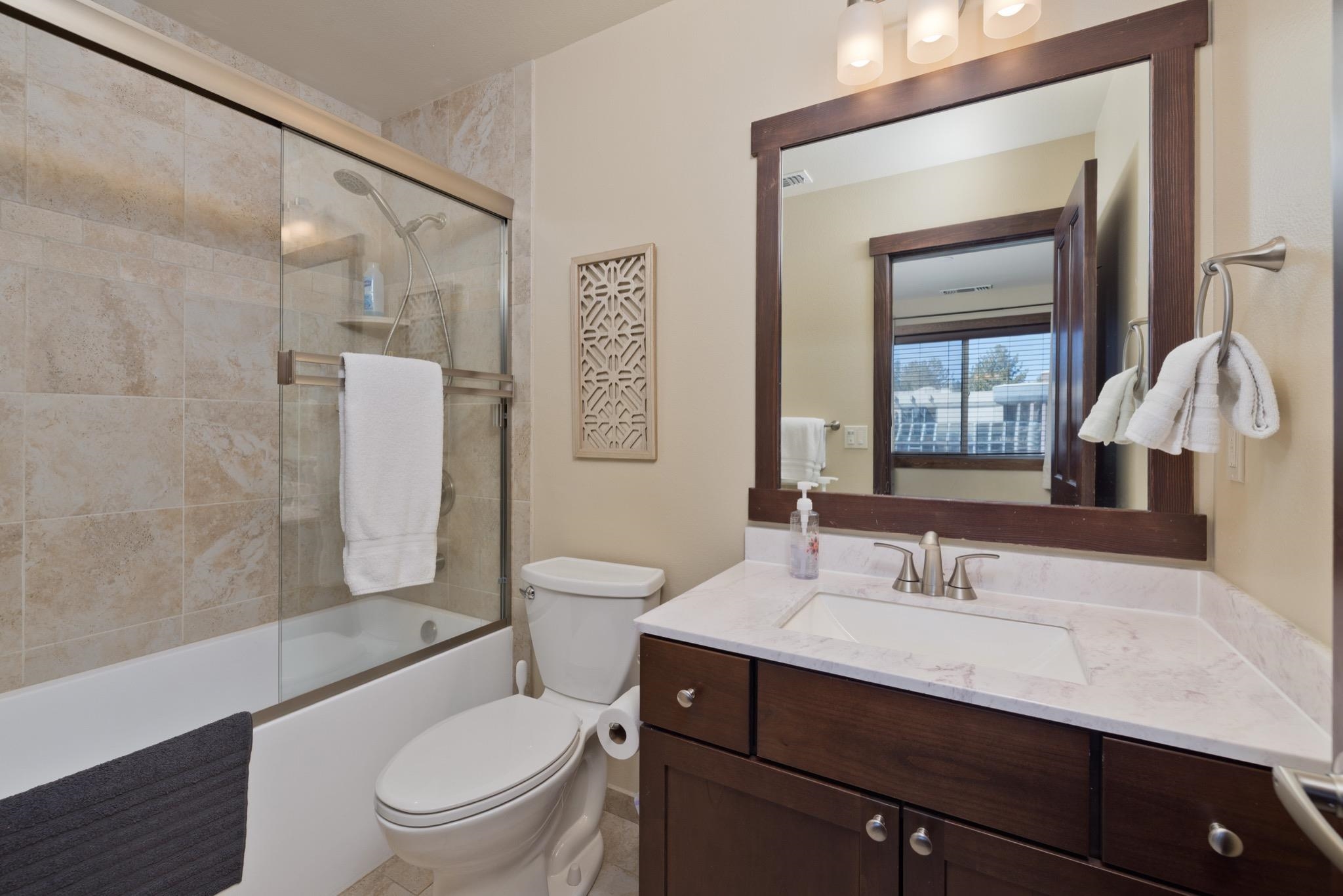 28 Oak Tree Way, Unit 8 Mammoth Lakes, CA 93546 - Photo 26 of 32 Bathroom featuring vanity and bath / shower combo with glass door