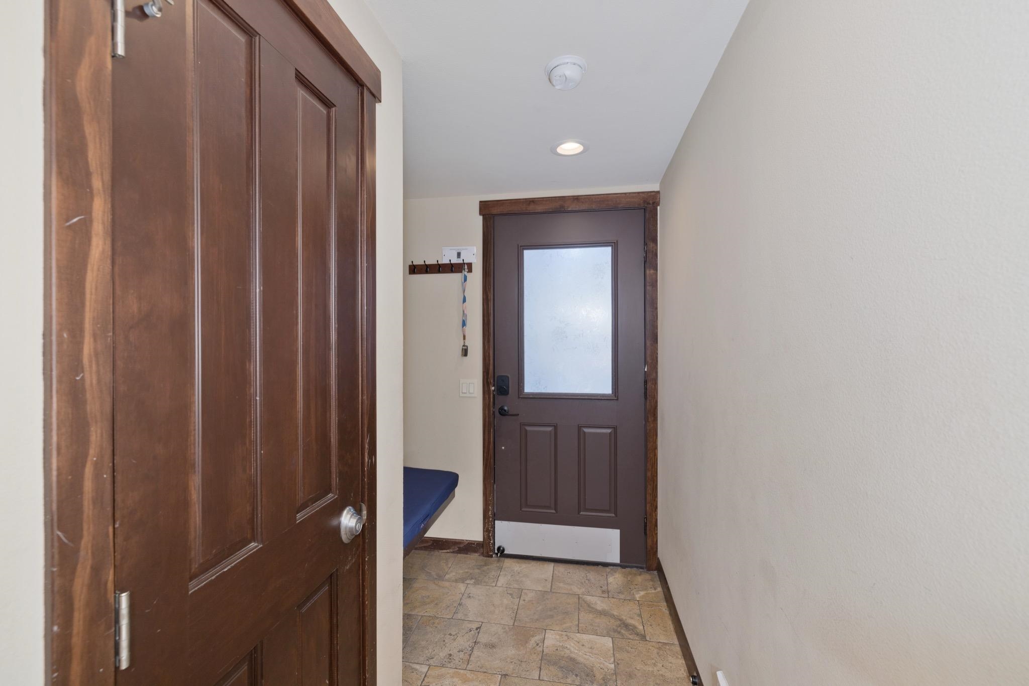 28 Oak Tree Way, Unit 8 Mammoth Lakes, CA 93546 - Photo 3 of 32 Doorway with stone finish flooring and recessed lighting